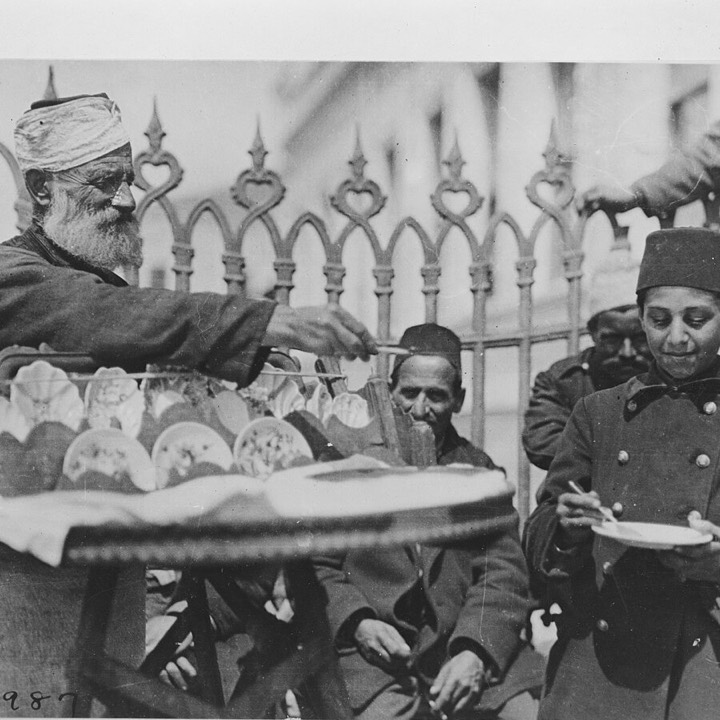 A street food seller and a boy eating, Istanbul, 1920